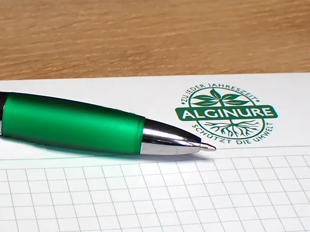 Kugelschreiber auf einem Notizblock der Tilco-Alginure GmbH Kugelschreiber auf einem Notizblock der Tilco-Alginure GmbH